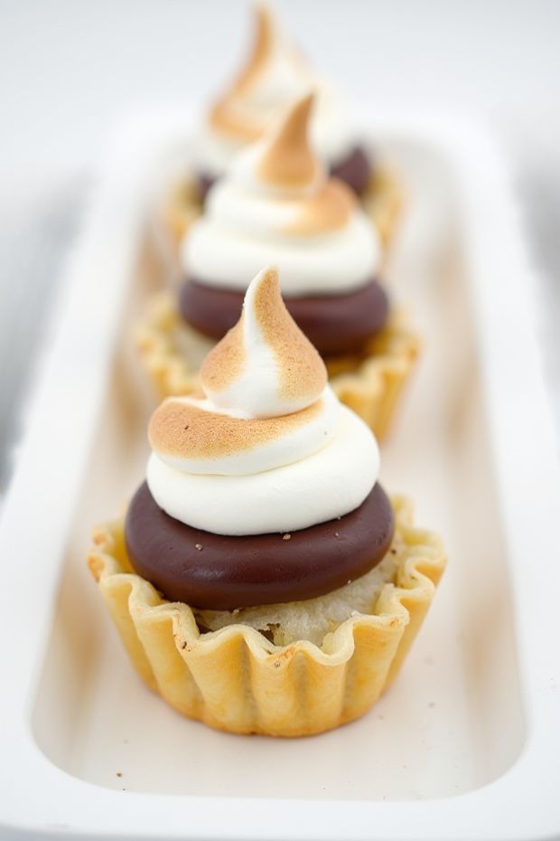 Gourmet s'mores puff pastry mini tarts with chocolate ganache, marshmallow, and toasted meringue topping.