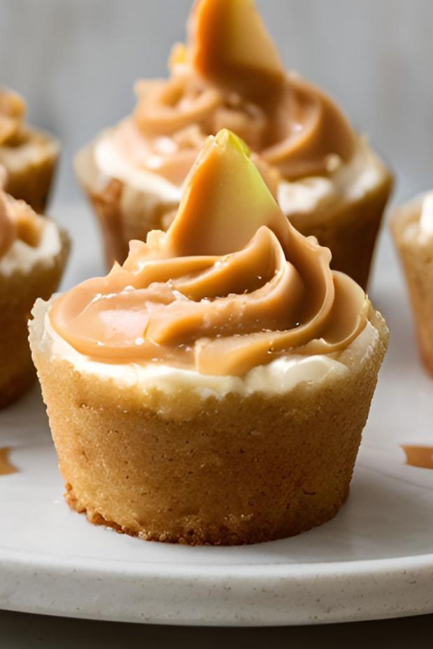 Salted caramel apple layer cake cups with cream cheese frosting and caramel drizzle.