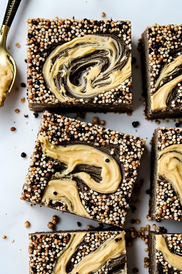 Black Sesame Tahini Slices with a creamy tahini swirl atop a sesame crust, perfect for a nutritious sweet treat.