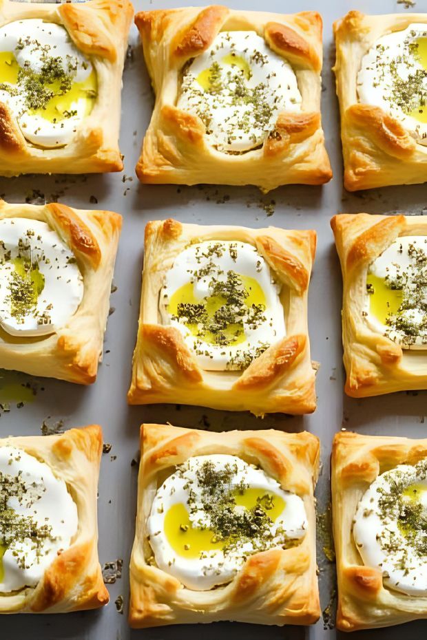 Zaatar Labneh Puff Squares topped with rich labneh and zaatar oil, perfect for appetizers and snacks.